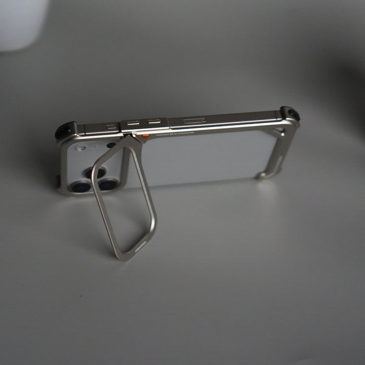 iPhone 17 Pro 9-Shaped Frameless Metal Bumper Case with Hidden Lens Stand | Shockproof Aviation-Grade Alloy Frame